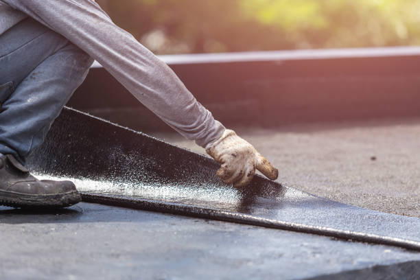 Professional Basement Waterproofing technician working in Walton, KY